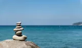 stones-pyramid-pebble-beach-symbolizing-stability-zen-harmony-balance_41362-42_138211.jpg
