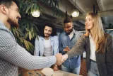 female-office-executive-shaking-hand-new-male-team-member-employee115910.jpg